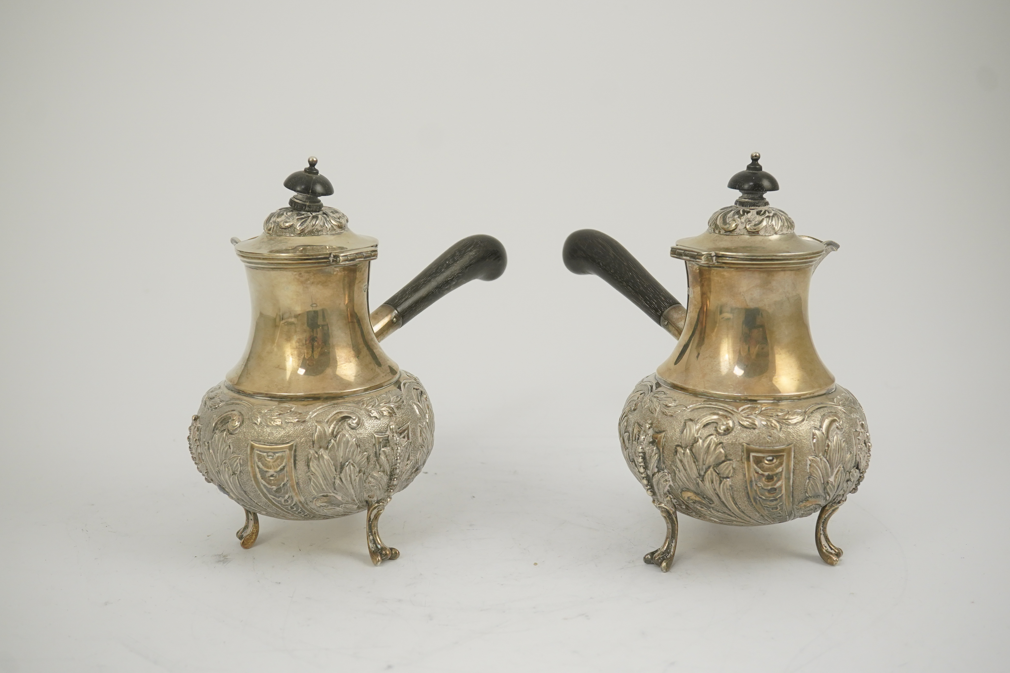 A pair of George V silver chocolate pots, by Goldsmiths & Silversmiths Co Ltd